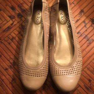 Tan leather flats.